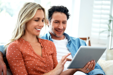 Couple Watching Laptop Looking at Fertility Treatment Options