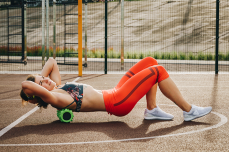 Female Foam Rolling in Activewear Post Exercise Recovery