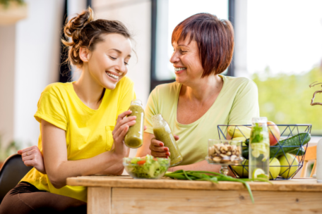 Young woman and older woman with healthy food balanced diet
